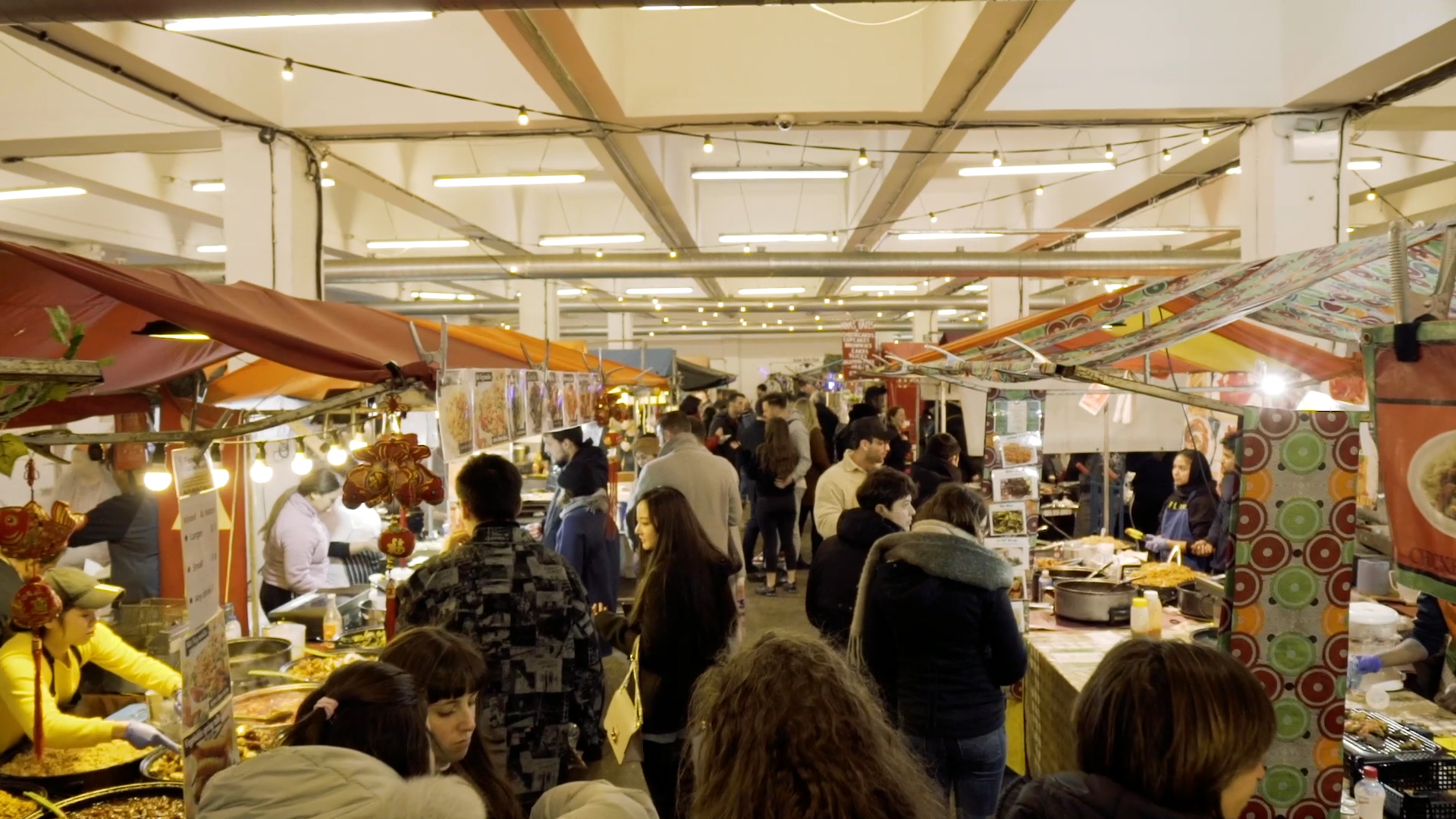 Shoppers at Brick Lane Vintage Market, widely considered one of the best vintage markets in London for fashion and antiques